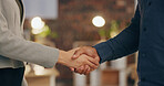 Night, office and business people shaking hands for deal, agreement or collaboration at creative agency. Welcome, introduction and team handshake for partnership, project success or congratulations