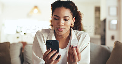 Buy stock photo Phone, medicine and remote work with business woman on sofa in living room of home for research. Healthcare, medical and prescription with African employee reading pharmaceutical info in apartment