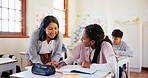 Happy teacher, student and teenager with book for help, support or assistance on question at school. Young, female person or educator with learner for exam, test or learning in classroom assessment