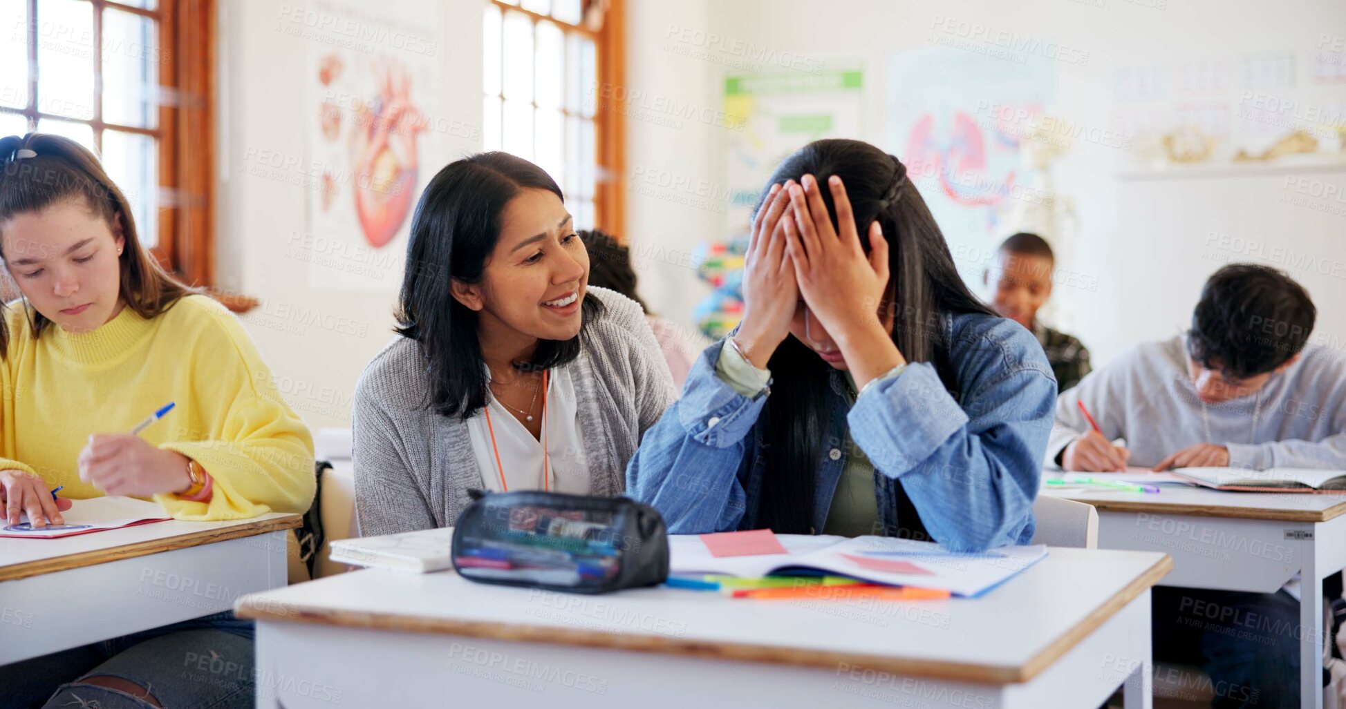 Buy stock photo Frustrated girl, student and stress with teacher for support, comfort or assistance in test, exam or classroom assessment. Young, female person or teenager with help for anxiety, nerves or assignment