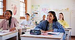 Happy teenagers, students and laughing with humor in classroom for funny joke together at school. Young, group or learners with smile, books or desk for fun education, learning or youth development