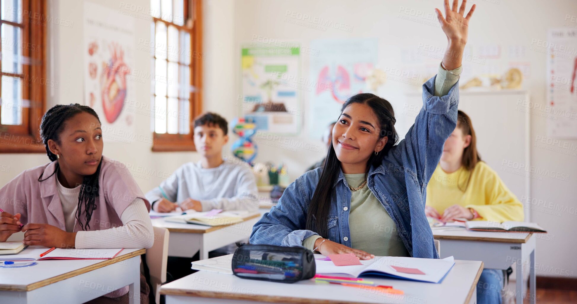 Buy stock photo Happy girl, students and hands raised with question in classroom for interaction, learning or education at school. Young, group or learners with answer or faq in engagement, quiz or youth development