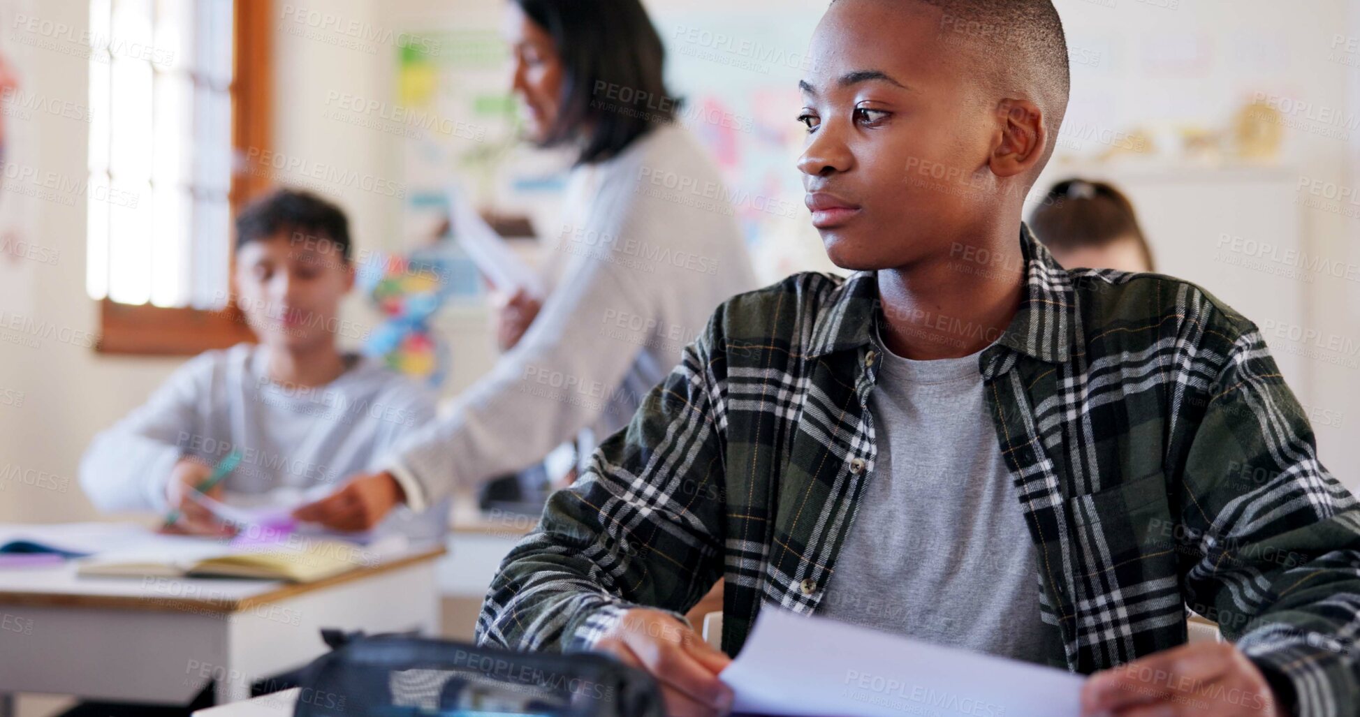 Buy stock photo Boy, student or paper with bad results for moderation, examination or evaluation in classroom at school. Young, male person or disappointed learner with mistake or failure for exam, test or low score