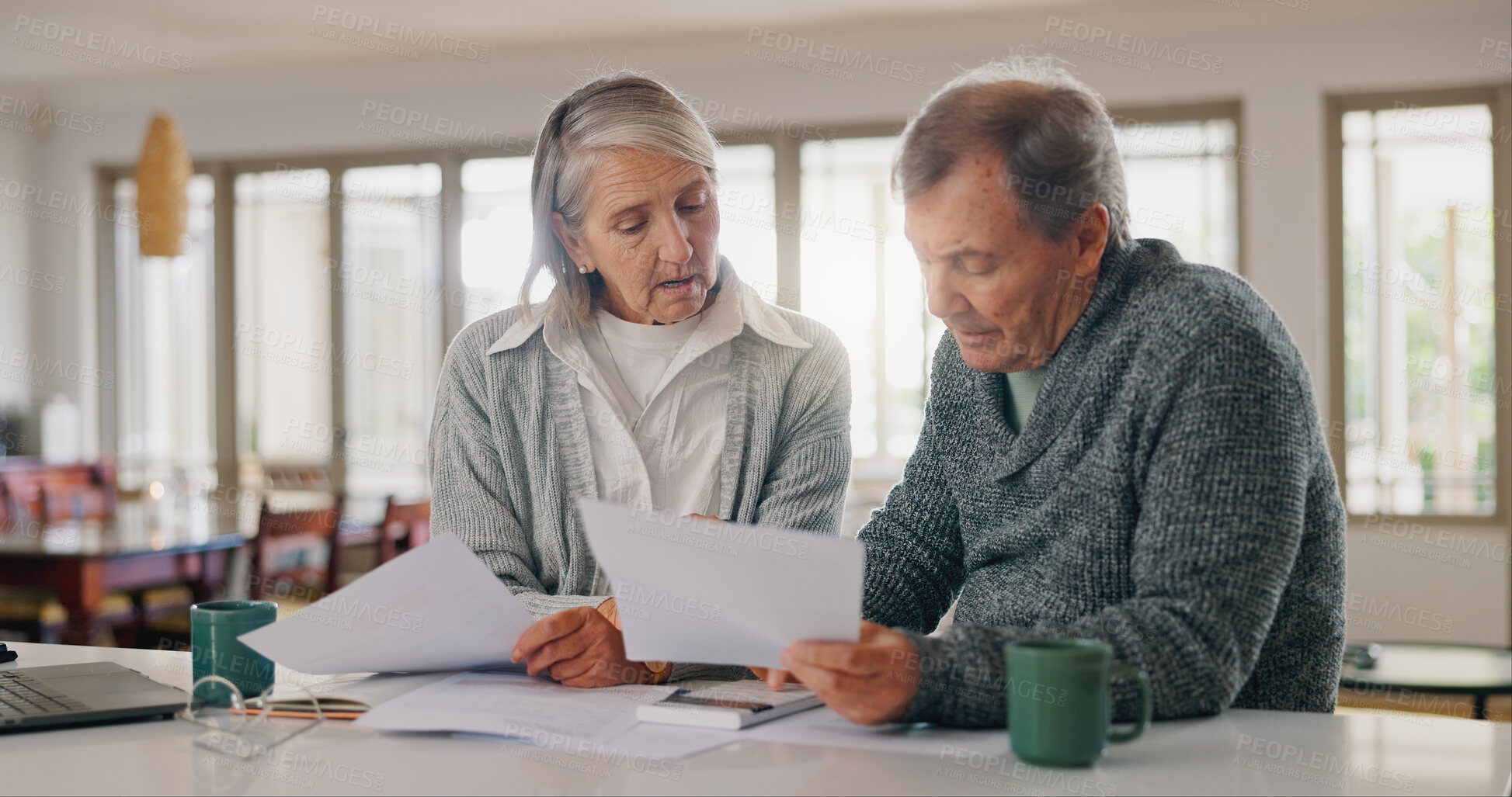 Buy stock photo Senior couple, documents and budget planning with finance for pension, investment or expenses at home. Elderly, man and woman with paperwork for bills, funding or payments together on table at house