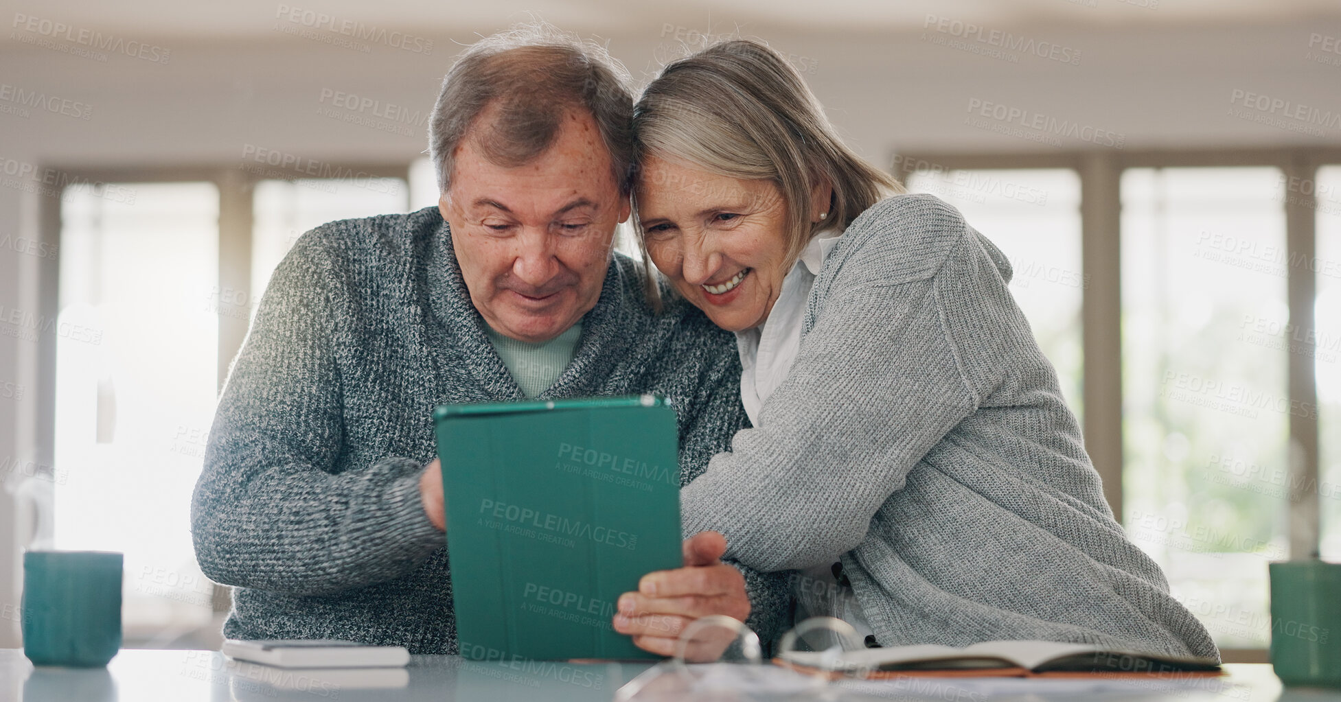 Buy stock photo Senior couple, tablet and home for online banking, happy and search website for credit score. Elderly people, calculate pension and notebook for bills or payment, finance and embrace for security