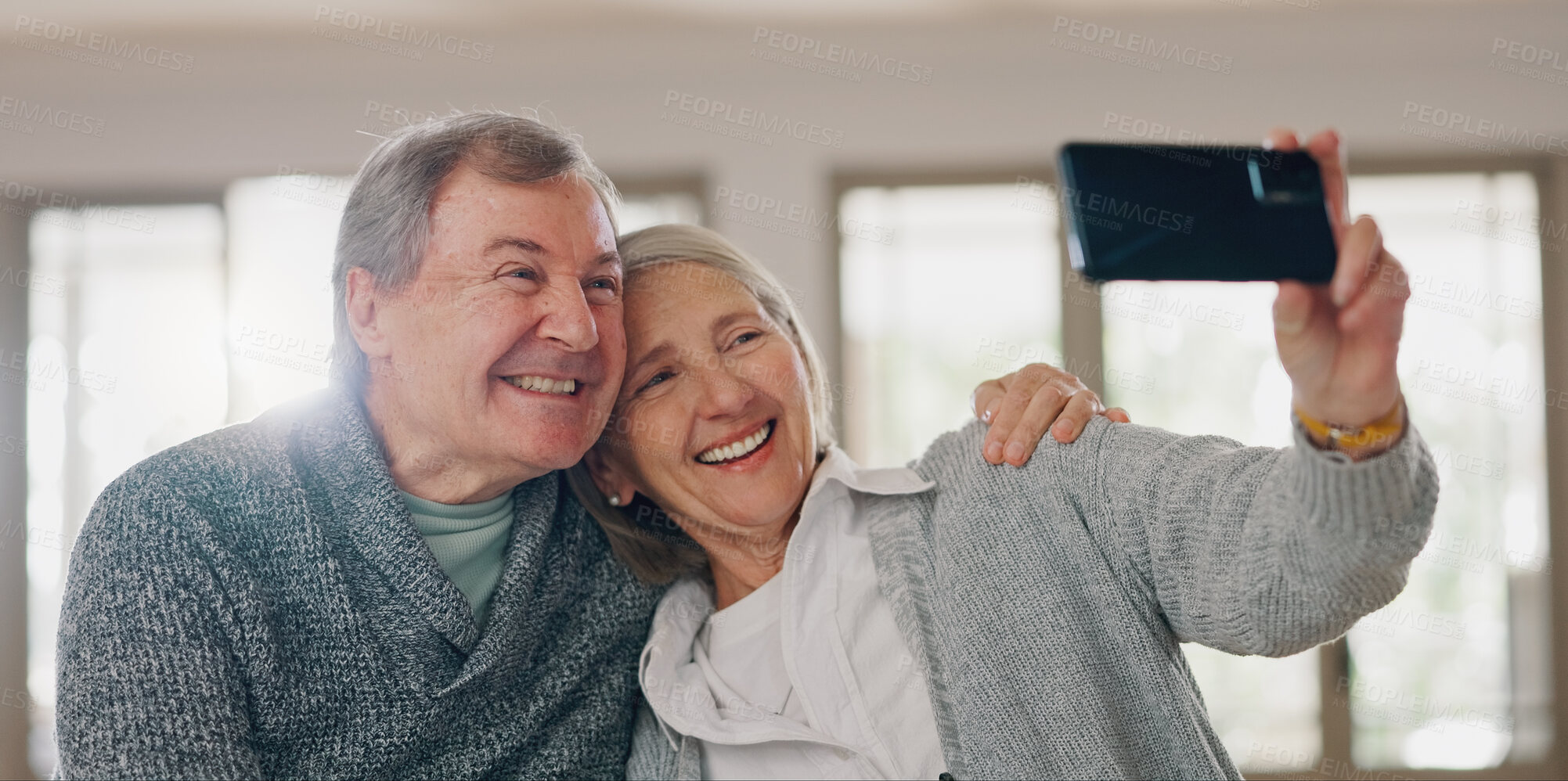 Buy stock photo Senior couple, selfie and hug in home, photography and online for social media post in living room. Elderly people, happy and embrace for security in relationship, love and profile picture for memory