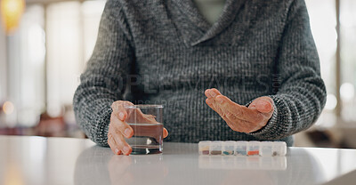 Buy stock photo Old man, hands and tablet container in home, arthritis treatment and water for antibiotics or drugs. Male person, healthcare and pharmaceutical organizer on table, pills and medication for joint pain