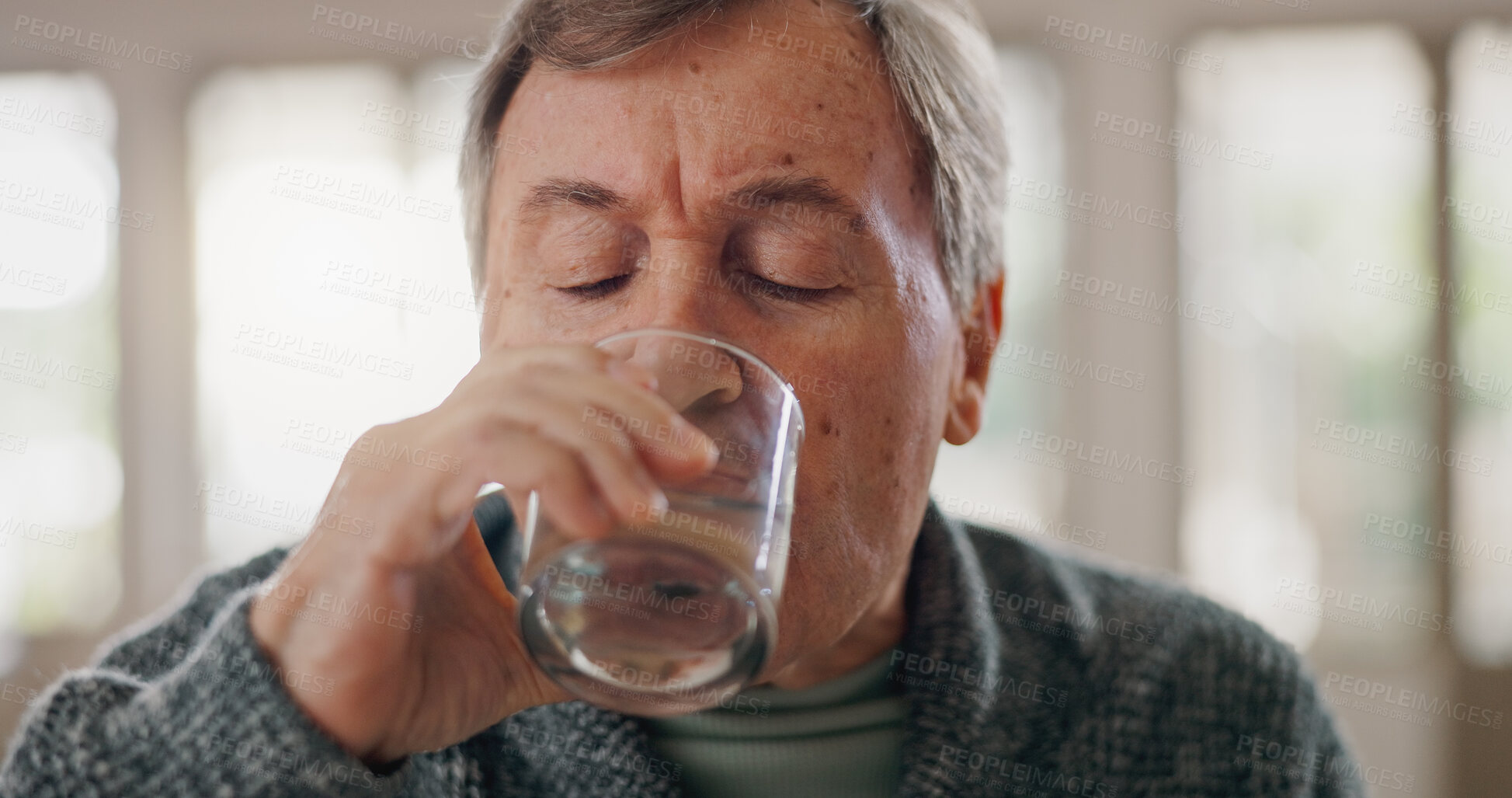 Buy stock photo Senior man, diet and water in home, refreshing liquid and living room for mineral nutrition. Male person, glass and morning drink for hydration, cold fluid and natural vitamin detox in retirement