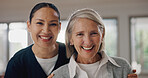 Happy, portrait and nurse with senior woman in retirement home for healthcare consultation. Smile, hug and Asian caregiver with elderly female patient for medical routine checkup at assisted living.