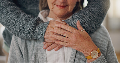 Buy stock photo Hands, hug and senior man with wife in home for comfort, bonding and love in marriage together. Care, empathy and closeup of elderly person embracing woman for connection in relationship at house.