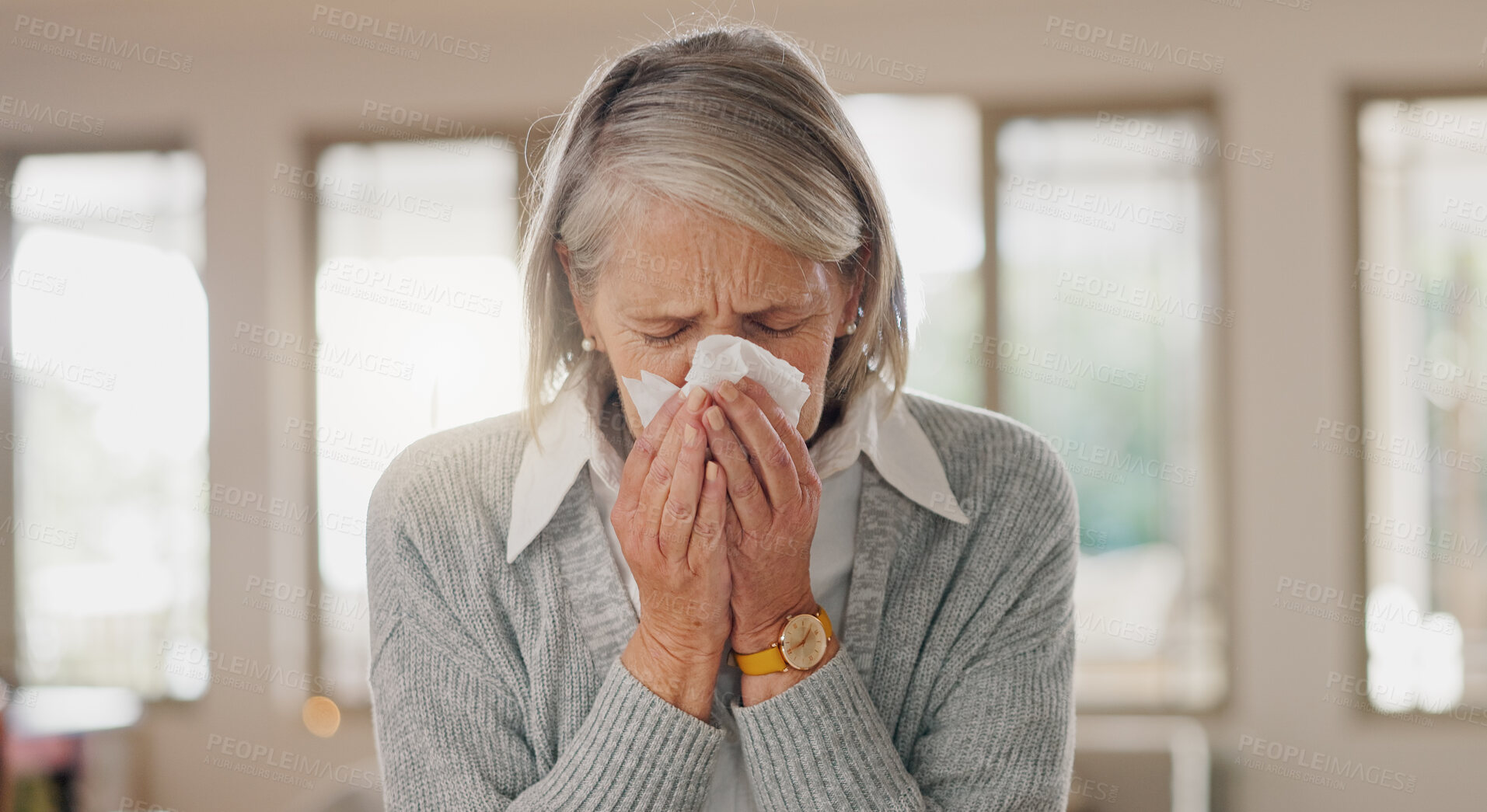 Buy stock photo Senior woman, tissue and blowing nose in home, sick and retirement with flu, cold or sinus in morning. Elderly person, paper and cleaning for hygiene, allergies or sneeze with hay fever at apartment