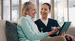 Tablet, conversation and nurse with senior woman in home for medical consultation on sofa together. Digital technology, discussion and caregiver explain diagnosis to elderly female patient at house.