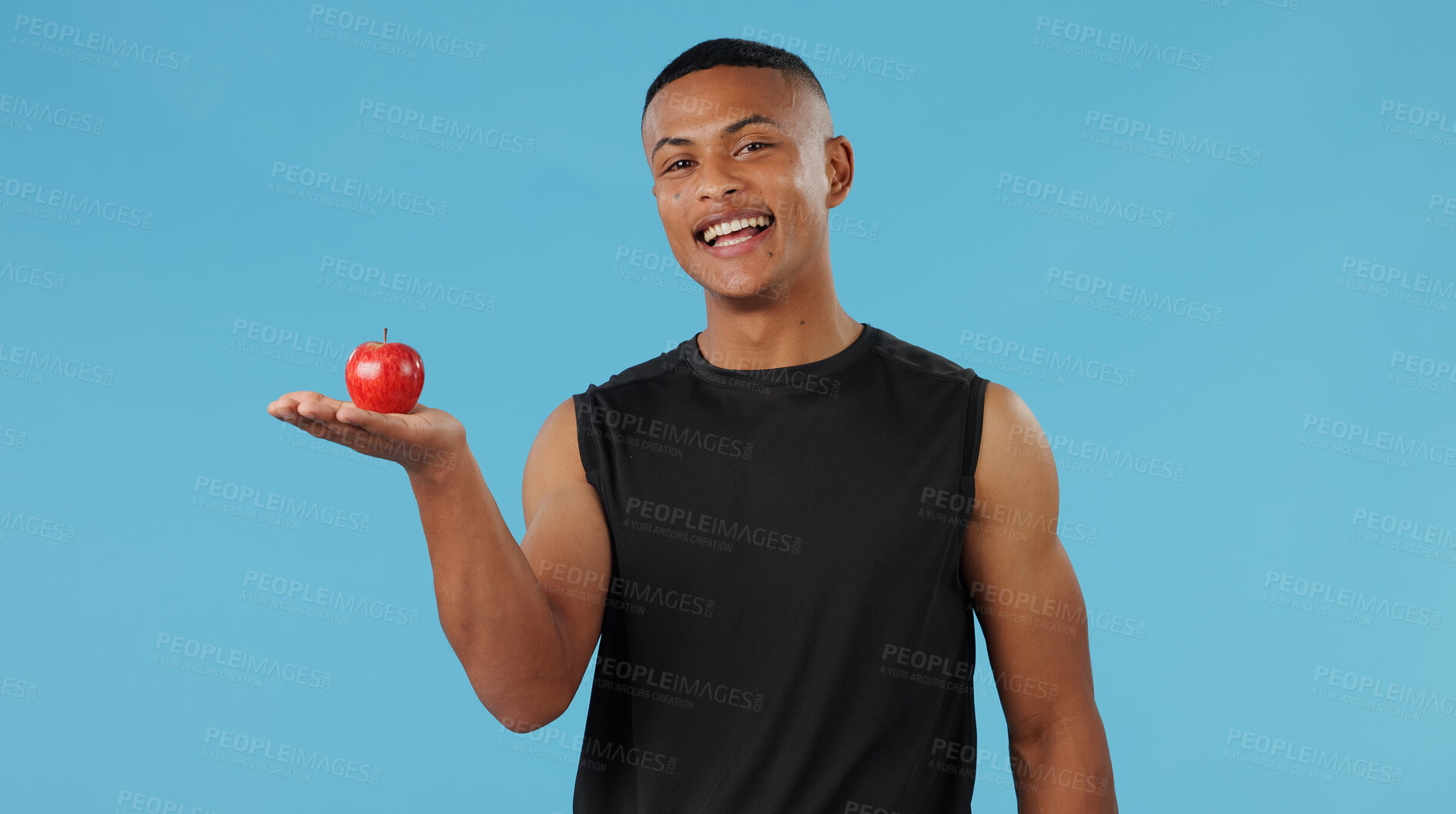 Buy stock photo Man, portrait and apple in studio for health, nutrition and wellness with diet, vitamin C and fiber. Male person, healthy and fruit on blue background for food, eating and weight loss with detox