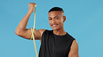 Man portrait, bicep and measuring muscle in studio, check and bodybuilder flexing on blue background. Male person, fitness and results of weightlifting, monitor arm progress and tool for development