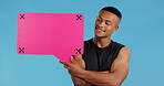 Man, speech bubble and smile in studio for announcement, opinion or gym subscription by blue background. Personal trainer, pink board and happy with mockup space, review or vote with tracking markers