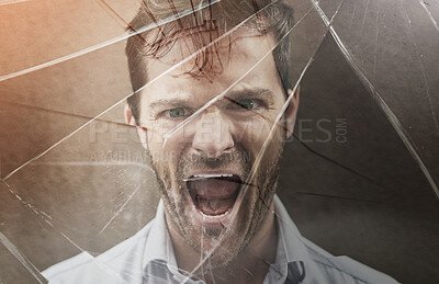 Buy stock photo Portrait of an angry young man standing against a dark background