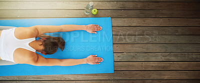 Buy stock photo High angle shot of a young woman working out at home