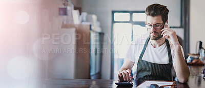 Buy stock photo Cropped shot of a young barista taking orders via cellphone