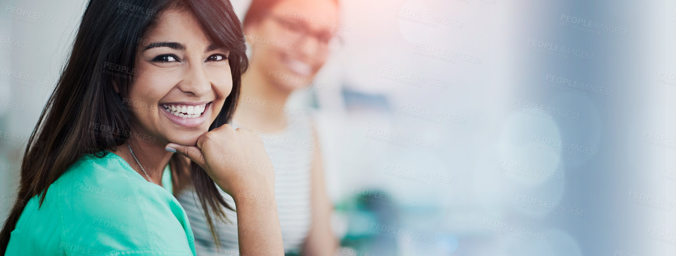 Buy stock photo Portrait of an attractive young woman sitting at a table with colleagues in the background