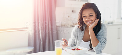 Buy stock photo Portrait of a happy young woman enjoying a healthy breakfast at home