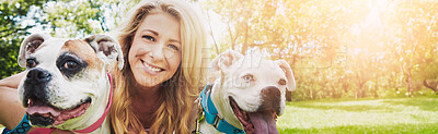 Buy stock photo Shot of a young woman bonding with her dog in the park