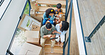 Parents, children and boxes on stairs in new home with tablet for property design and interior decoration research. Top view, family or digital app in dream house with renovation inspiration or ideas