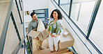 Couple, moving and above with box in portrait for property, investment and packing for new home. Happy, man and woman with cardboard package by stairs for real estate, mortgage and marriage residence