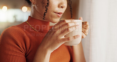 Buy stock photo Coffee, hands and warm with woman closeup in living room of home for morning beverage or caffeine. Blow, cup and mug with person in apartment to enjoy fresh drink to relax for weekend wellness