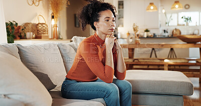 Buy stock photo Depression, heartbreak and lonely with woman on sofa in living room of home for anxiety or contemplation. Bored, sad and thinking with unhappy African person in apartment for breakup or separation