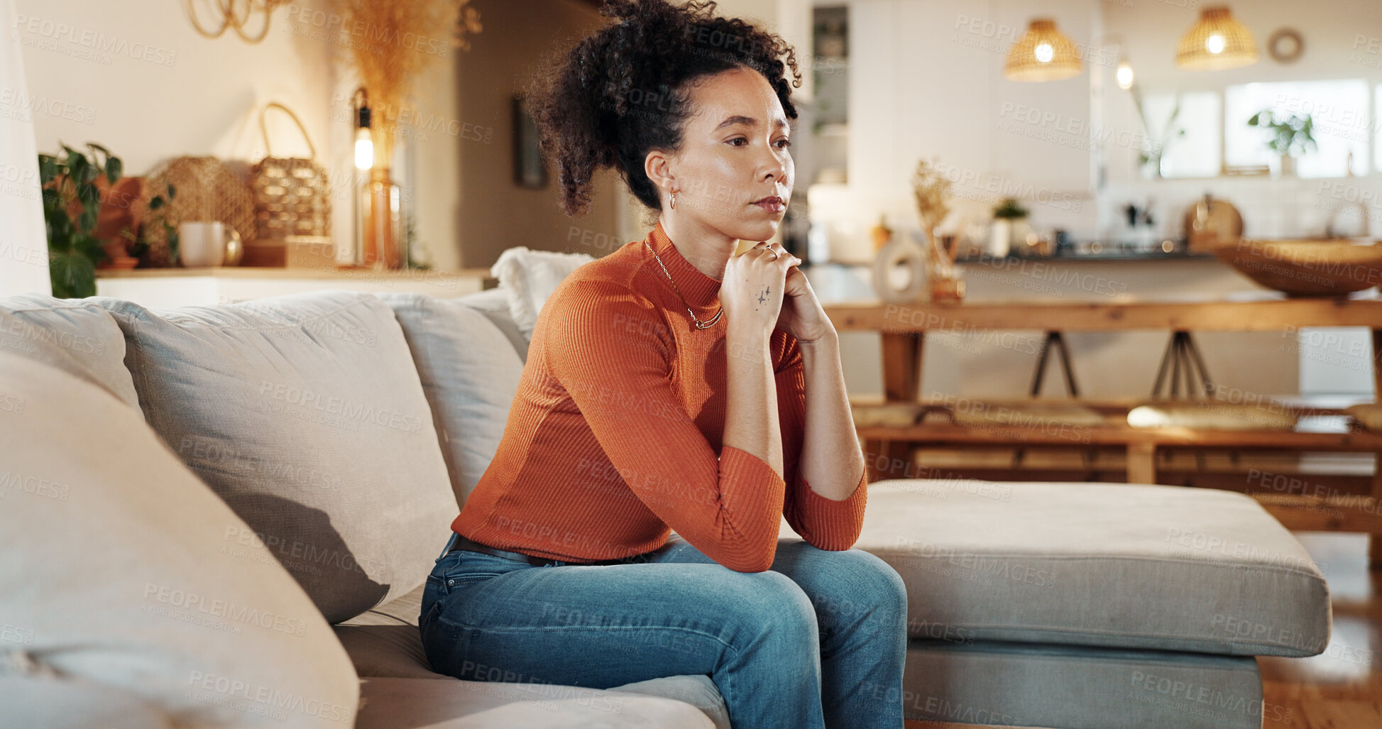 Buy stock photo Depression, heartbreak and lonely with woman on sofa in living room of home for anxiety or contemplation. Bored, sad and thinking with unhappy African person in apartment for breakup or separation