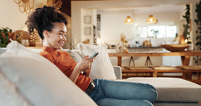 Buy stock photo Phone, relax and smile with woman on sofa in living room of home for communication or social media. App, internet and wellness with happy African person in apartment for ecommerce or online shopping