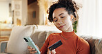 Credit card, ecommerce and phone with woman on sofa in living room of home for bank payment. Fintech, online shopping and transaction with African customer person in apartment for internet purchase