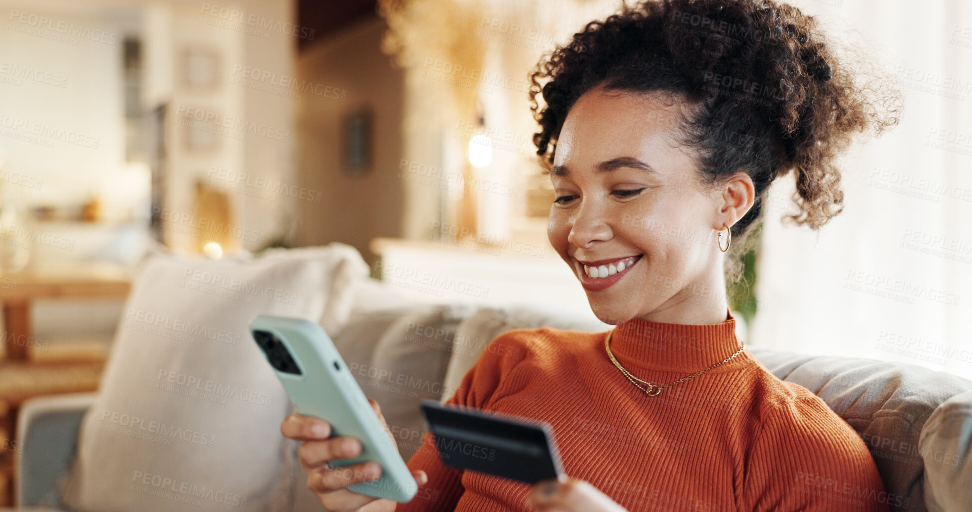 Buy stock photo Phone, credit card and African woman in home with online shopping, deal and web payment. Living room, sofa and relax with internet bank app and ecommerce with digital purchase and mobile with smile