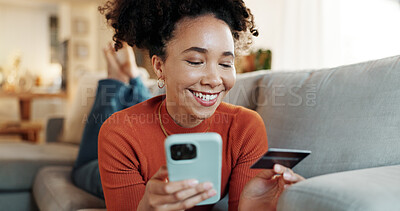 Buy stock photo Phone, credit card and payment of African woman in home with online shopping, deal and website sale. Living room, sofa and relax with internet bank app and ecommerce with digital purchase and smile