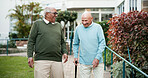 Senior men, laughing and bonding in retirement home as pensioner for activity, walk and relax. People, elderly care and friends for outdoor in garden, park or backyard in nursing village or community