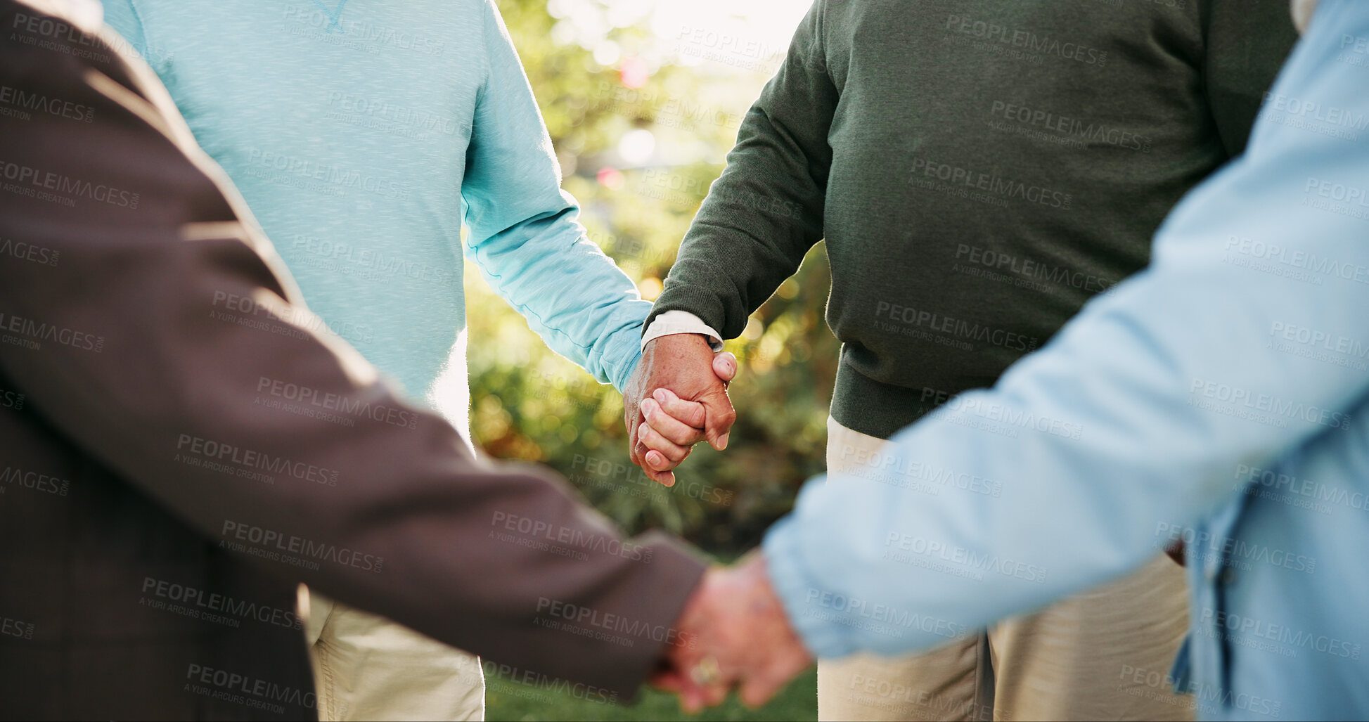 Buy stock photo Senior group, park and holding hands for support, connection or community care outdoor. Friends, team or together in nature in circle for trust, solidarity or kindness of elderly people in retirement