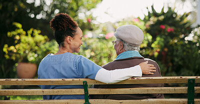 Buy stock photo Caregiver, senior woman and relax on bench outdoor for nursing support, retirement and comic conversation. Back, volunteer and people with comfort for nature wellness, funny discussion and empathy 