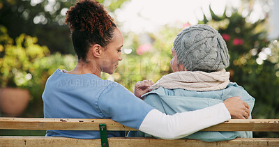 Buy stock photo Volunteer, elderly woman and hug on bench outdoor for nursing support, retirement and comic conversation. Smile, caregiver and people with embrace of wellness assistance, empathy and residential care