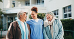 Elderly care, people and happy with nurse for support, hug and trust development at nursing home. Outdoor, senior women and laughing with caregiver for joke, funny story telling and fun in retirement