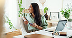 Phone, thinking and woman at desk in home office with laptop, smile and inspiration for freelance project. Remote work, relax and girl with smartphone for online chat, connectivity and business ideas