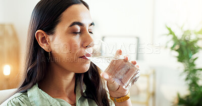 Buy stock photo Business woman, water and drinking with glass for hydration, beverage or refreshment at office. Young, female person or employee with mineral liquid, thirst or cleanse for natural sustainability