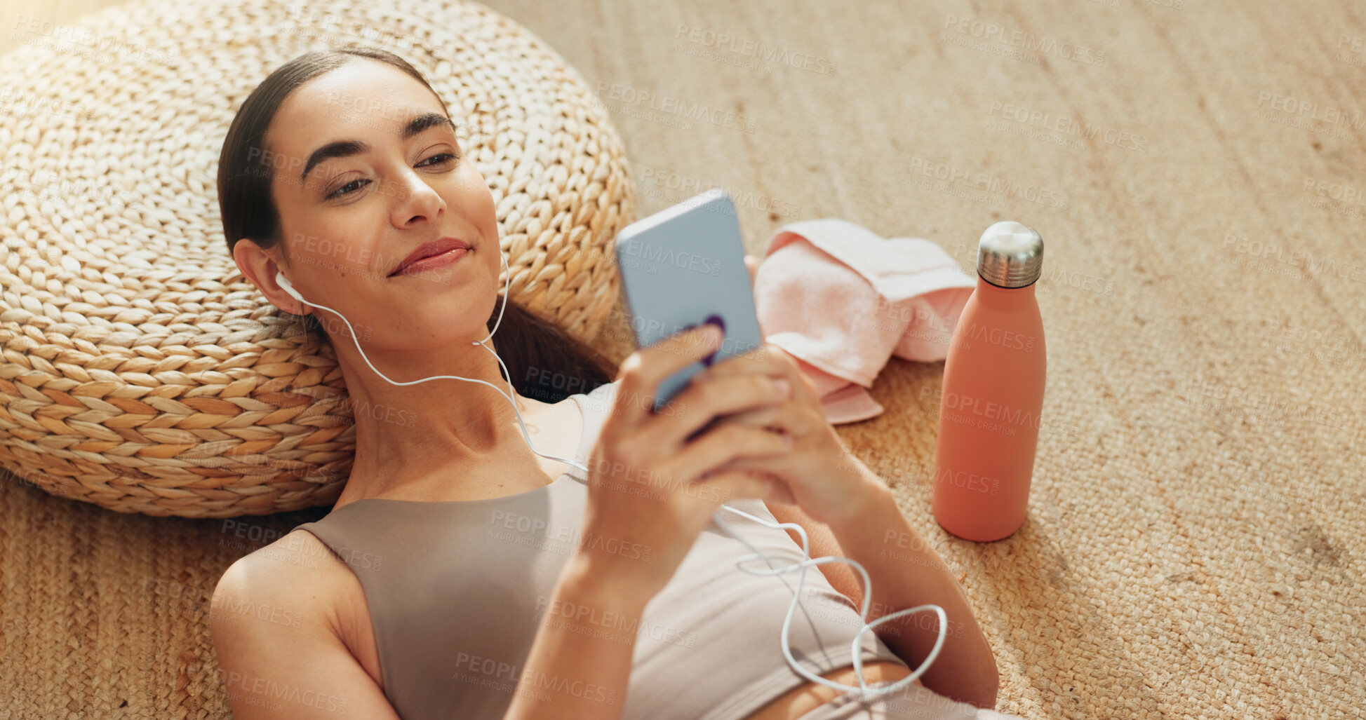 Buy stock photo Music, phone and exercise with woman in home for streaming, fitness podcast and peace. Relax, internet and wellness app with person listening to zen audio on floor for mental health, yoga and pilates