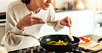 Woman, aroma and frying pan as chef in kitchen for diet or recipe in home for satisfaction. Female person, cooking and gourmet cuisine as creative or nutritionist for meal preparation, dinner or food