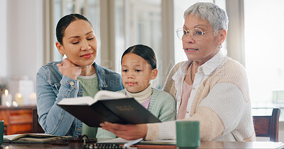 Buy stock photo Grandmother, kid and mother with bible in home for generations, worship and teaching religion. Family, women and little girl with scripture in house for gospel, learning and education of Holy Spirit