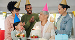 Happy, family and celebration with grandmother on birthday for surprise, present and special event at home. Party hat, people and child with applause by senior woman for cake, candles and dessert