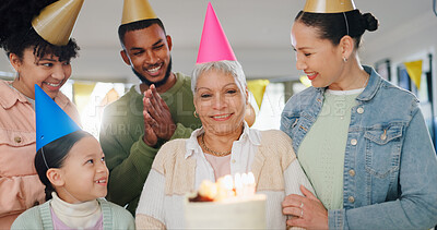 Buy stock photo Family, smile and celebration with grandmother on birthday for surprise, support and special event at home. Party hat, people and child with applause by senior woman for cake, dessert and candles