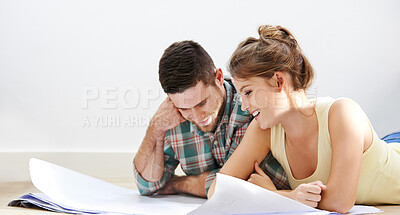 Buy stock photo New home, blueprints and couple on floor, planning and conversation for renovation. Happy people, apartment and man with woman, documents and discussion with cooperation, real estate and property