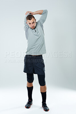 Buy stock photo Man, portrait or stretching elbow in studio for body health, fitness training or flexibility exercise. White background, arm muscle warm up or serious athlete with workout, gym or sports in France