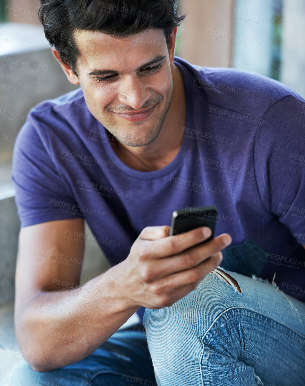 Buy stock photo Happy man, typing and browsing with phone for social media, communication or chatting at home. Young, male person or user with smile on mobile smartphone for online texting, app or news at house