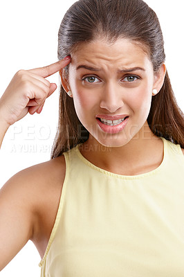 Buy stock photo Confused, woman and pointing to head in portrait for judgement, sarcasm and wtf expression. Frown, frustrated and face of female person with gesture for doubt, question and why by studio background